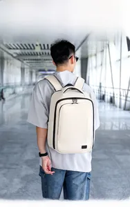 Outdoor model show of a stylish off-white expandable laptop backpack for commuters