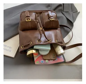 Macro shot of vintage leather backpack storage capacity with tablet and accessories