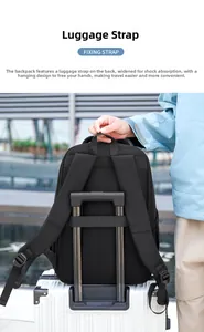 Detail of black backpack showing reinforced luggage strap fixed to suitcase handle