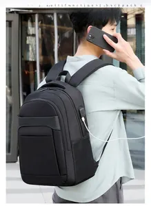 Detailed view of black business laptop backpack with side USB charging port for commuters