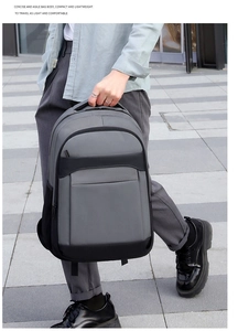 Modern casual business laptop backpack shown being carried in an outdoor urban setting
