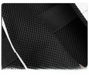 Detail of breathable mesh shoulder strap with white piping and reinforced nylon stitching