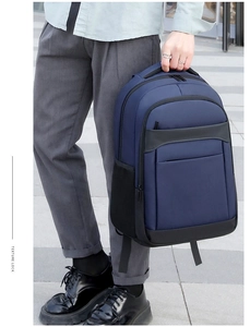 Detail of durable navy blue backpack with reinforced handle and texture look text