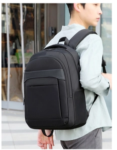 Outdoor shot of a black business laptop backpack with padded breathable mesh shoulder straps