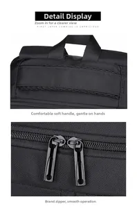 Detailed macro view of the padded top handle and smooth metal zippers on black laptop bag