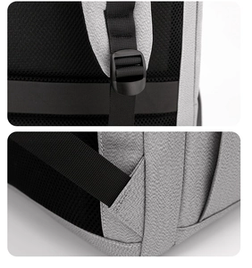 Détail du rembourrage dorsal en maille respirante et des coutures renforcées du sac gris