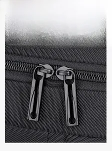 Detail of durable dual-way metal zippers on high-density black laptop backpack fabric