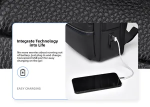 Detail of the external USB charging port on a black litchi grain leather business backpack
