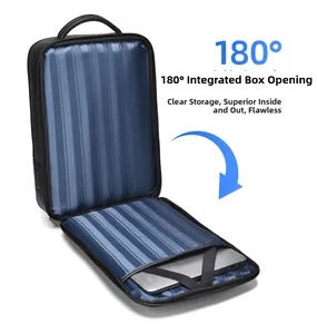 Detail of 180-degree suitcase-style opening showing laptop compartment and striped lining