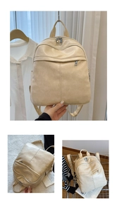 Detail of minimalist cream PU leather backpack with vertical stitching and silver hardware
