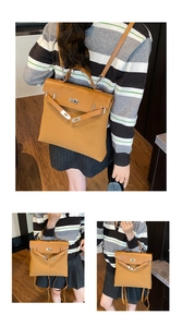 Detail view of brown vintage backpack featuring iconic metal twist lock and top handle