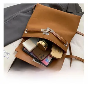 Detailed view of the brown leather backpack interior showing spacious storage for essentials