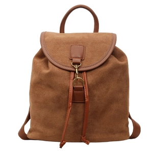 Brown matte suede backpack with leather trim and drawstring for a vintage retro look
