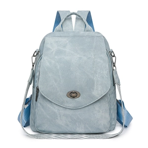Light blue multi-functional backpack with woven strap and metallic twist lock closure