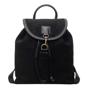 Detail of black frosted leather backpack with drawstring closure and golden metal hook