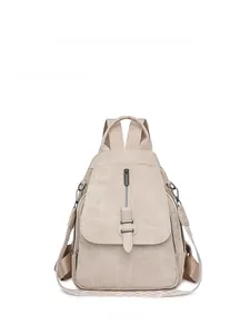 Detail of off-white PU leather backpack showing matte texture and front zipper design