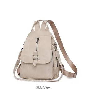 Side view of beige PU leather backpack with a decorative jacquard shoulder strap