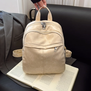 Minimalist cream soft PU leather backpack with multi-zipper compartments for travel