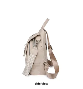 Side view of beige PU leather backpack featuring ethnic patterned strap and metal zippers