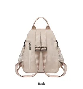 Detail view of beige soft PU leather backpack back with adjustable straps and anti-theft zip