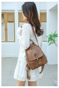 Brown PU leather backpack with vintage texture and stylish geometric pattern straps
