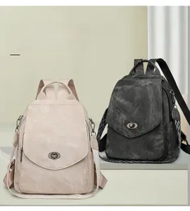 Macro detail of vintage soft leather backpacks with metal buckles and woven straps