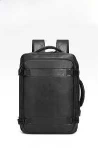 Detail of black PU leather backpack showing reinforced side handle and compression straps