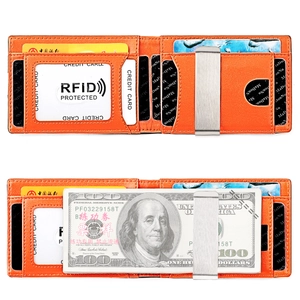 Detail view of orange leather wallet interior with card slots and silver money clip