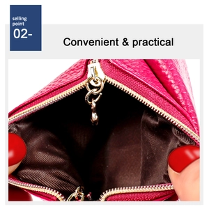 Detail view of the rose red leather coin purse with golden zipper and spacious interior