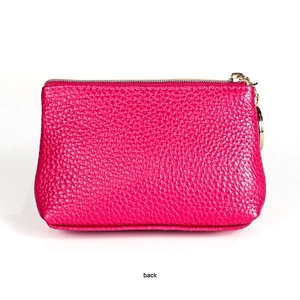 Back view of magenta genuine leather coin purse with lychee texture and gold key ring