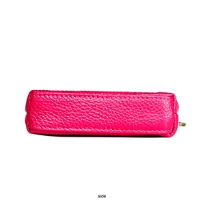 Side view of rose red pebble leather coin purse showing premium stitching and texture