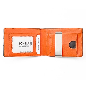 Orange leather bifold wallet detail showing internal RFID card slots and silver money clip