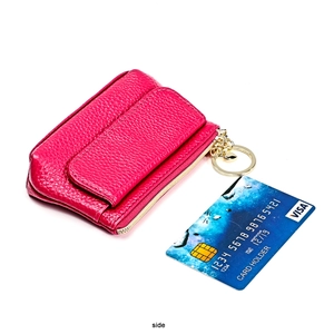 Detailed close-up of rose red lychee grain leather coin purse with gold zipper