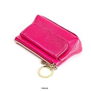 Close-up of magenta litchi grain leather coin purse with golden zipper and key ring