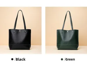 Détail de cabas en cuir noir et vert avec grain litchi et fermoir magnétique doré élégant