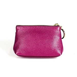 Detail of genuine leather coin purse with lychee texture and gold metal key ring