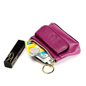 Detail view of purple leather coin purse showing storage for cards, cash and lipstick