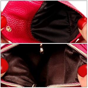 Close-up of litchi pattern leather coin purse with zipper and snap button interior
