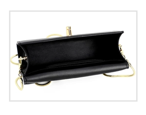 Detail view of black chain phone bag showing internal storage space and gold hardware