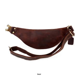 Back view of vintage dark brown leather waist bag with adjustable strap and metal hardware