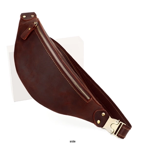 Side view of dark brown crazy horse leather waist bag with vintage metallic zippers