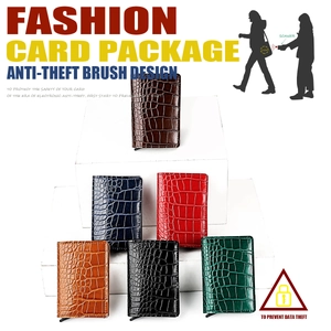 Detail view of RFID aluminum wallets with crocodile texture in multiple vibrant colors