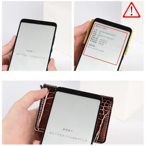 Detail of RFID blocking leather card holder showing NFC scanning function on smartphone