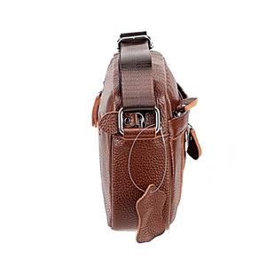 Detail of dark brown pebble leather shoulder bag showing stitching and side texture