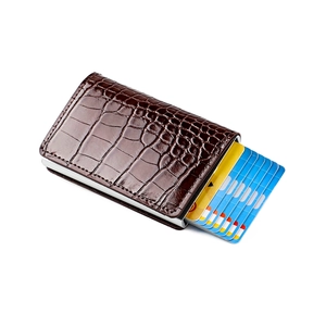 Detail of brown crocodile pattern wallet with pop-up aluminum credit card holder