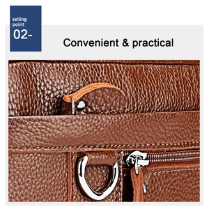 Detail view of premium brown litchi grain leather bag with durable metal D-ring