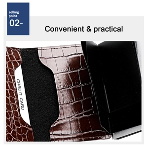 Detail of crocodile embossed leather wallet with automatic pop-up card mechanism and slots