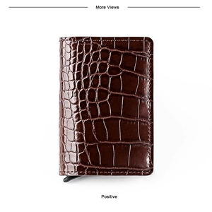Macro detail of dark brown crocodile texture on slim aluminum wallet with card pop-up button