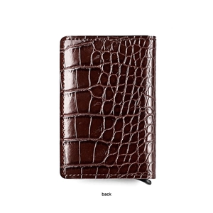 Back view of brown crocodile texture wallet with pop-up card mechanism and aluminum box