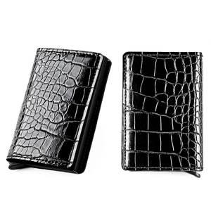 Detail of black crocodile texture aluminum card holder with RFID protection and pop-up mechanism
